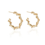 Load image into Gallery viewer, Edgy and fun, these mid sized Spike Hoops feature Natalie McMillan&#39;s signature etchings with a literal twist. They are made of solid 14k Gold, so you can wear them every day for a lifetime! 
